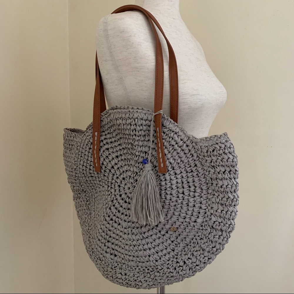 Capelli Strawworld Inc Gray Straw Circular Tote with Tassel